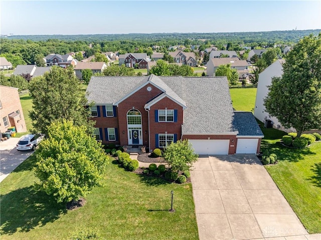 24 Dinsley Pl, Springboro, OH 45066 - view of front facade featuring brick siding, a residential view, driveway, a garage, and a front lawn