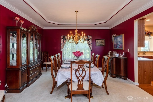 24 Dinsley Pl, Springboro, OH 45066 - dining room featuring a tray ceiling, a chandelier, light carpet, and ornamental molding