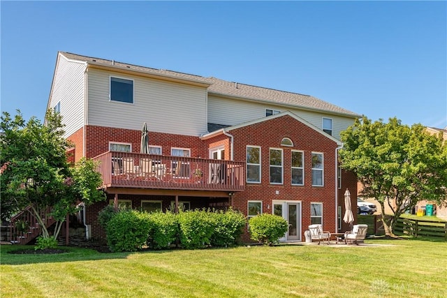 24 Dinsley Pl, Springboro, OH 45066 - back of property featuring brick siding, a lawn, a deck, and a patio