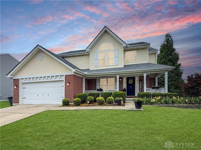 1207 Durbin Ter, Maineville, OH 45039 - traditional-style house featuring covered porch, driveway, a front yard, brick siding, and a garage