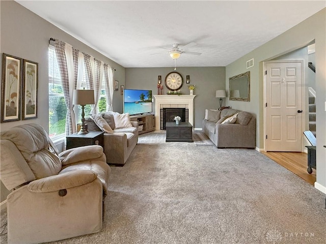 1207 Durbin Ter, Maineville, OH 45039 - carpeted living room featuring ceiling fan, a fireplace, and stairs