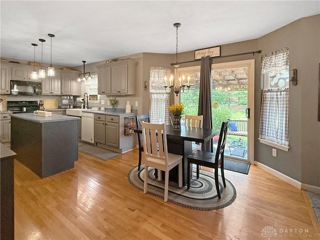 1207 Durbin Ter, Maineville, OH 45039 - dining space with a chandelier and light wood-style floors