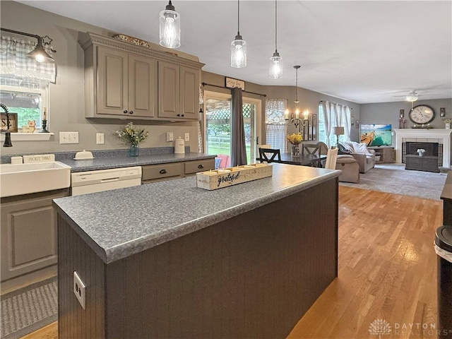 1207 Durbin Ter, Maineville, OH 45039 - kitchen with light wood finished floors, dark countertops, a chandelier, pendant lighting, and a kitchen island