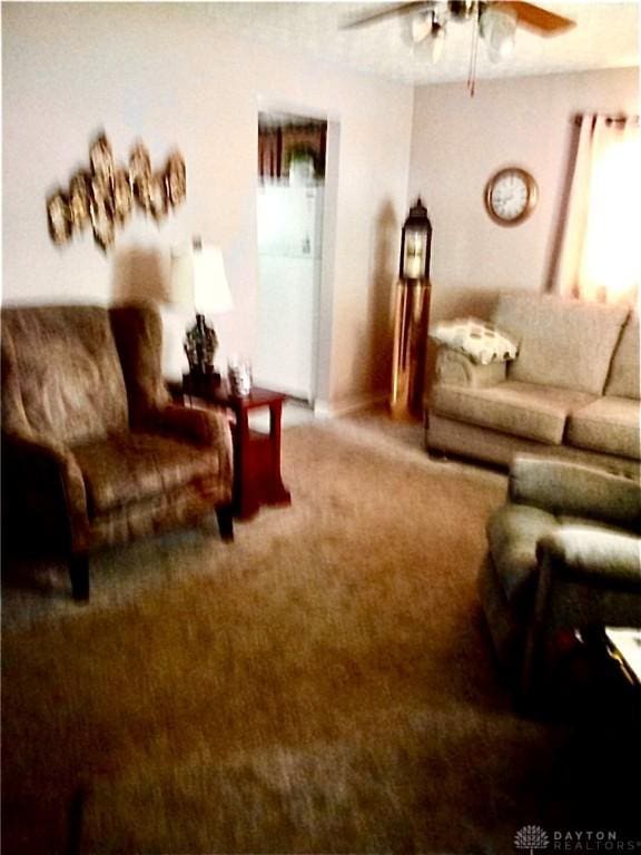 34 William St, West Carrollton, OH 45449 - living area with carpet flooring, a ceiling fan, and plenty of natural light