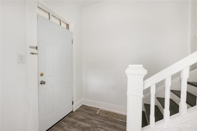 36 Leaman St, Xenia, OH 45385 - entryway featuring dark wood finished floors and stairway