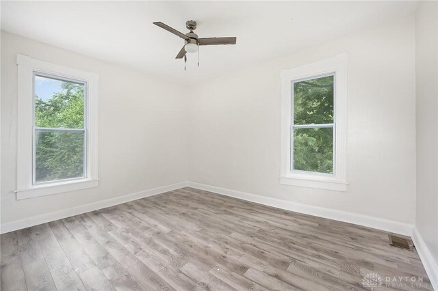 36 Leaman St, Xenia, OH 45385 - empty room with wood finished floors and ceiling fan