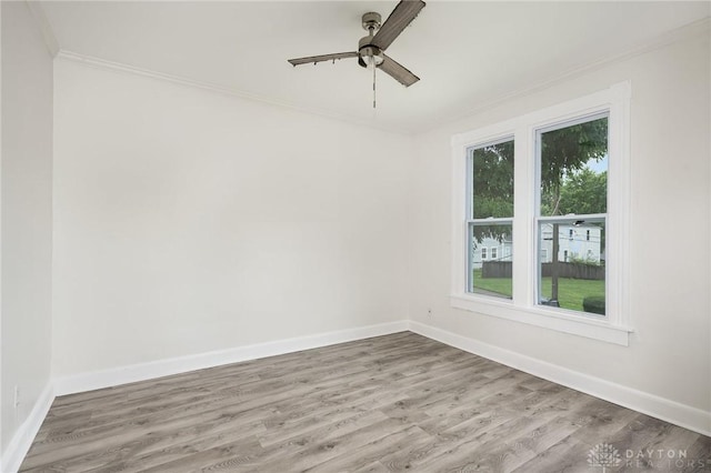 36 Leaman St, Xenia, OH 45385 - unfurnished room featuring crown molding, wood finished floors, and ceiling fan