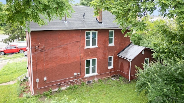 36 Leaman St, Xenia, OH 45385 - rear view of property featuring a lawn and brick siding