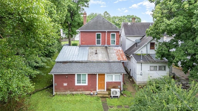 36 Leaman St, Xenia, OH 45385 - back of house featuring a yard and brick siding