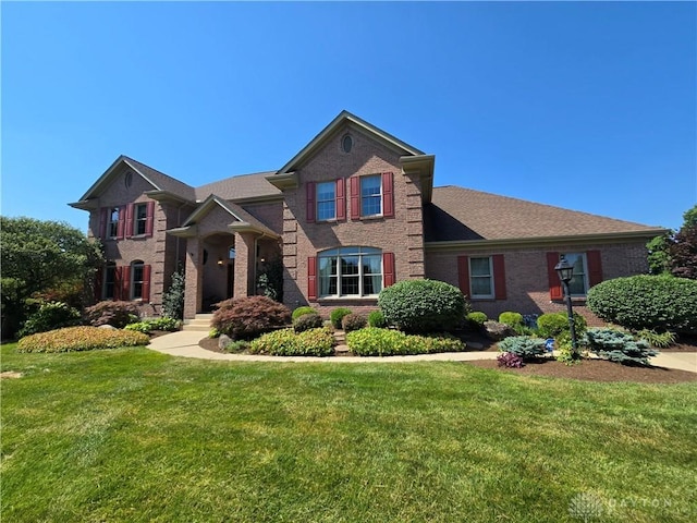 1962 Fountain View Dr, Dayton, OH 45414 - view of front of house featuring brick siding and a front lawn
