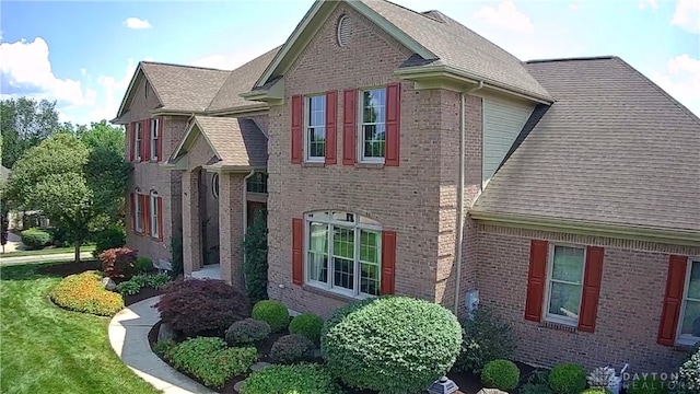 1962 Fountain View Dr, Dayton, OH 45414 - view of side of home with roof with shingles and brick siding
