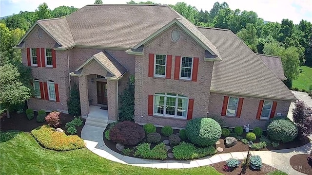 1962 Fountain View Dr, Dayton, OH 45414 - view of front facade with brick siding and roof with shingles