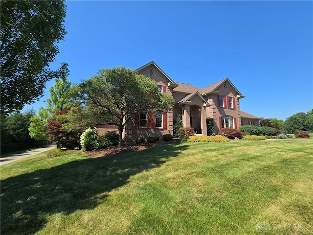 1962 Fountain View Dr, Dayton, OH 45414 - view of front of home featuring a front lawn and brick siding
