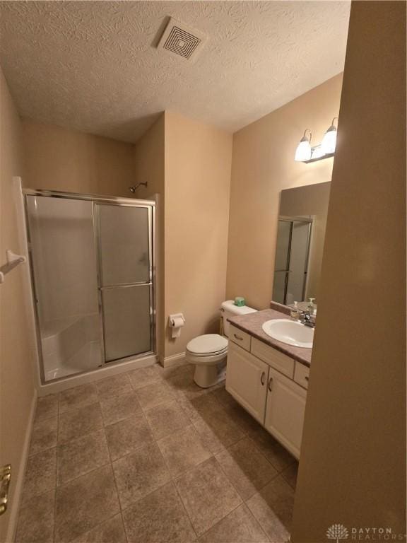 1962 Fountain View Dr, Dayton, OH 45414 - full bathroom with a stall shower, vanity, a textured ceiling, and tile patterned flooring