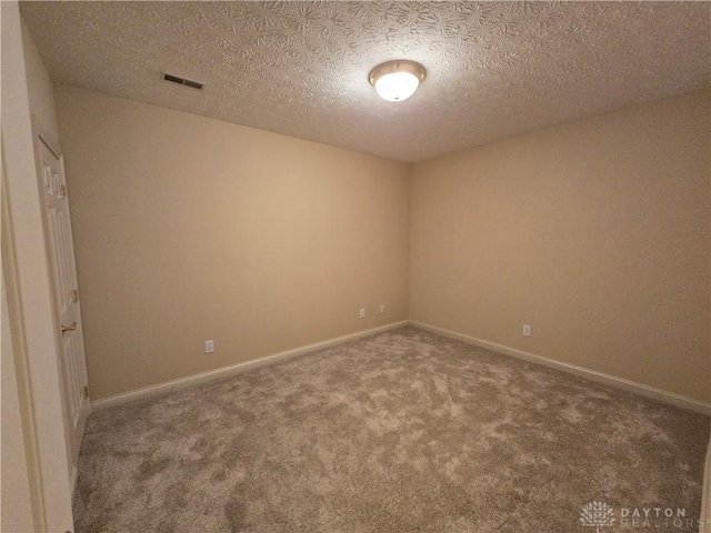 1962 Fountain View Dr, Dayton, OH 45414 - spare room featuring carpet and a textured ceiling