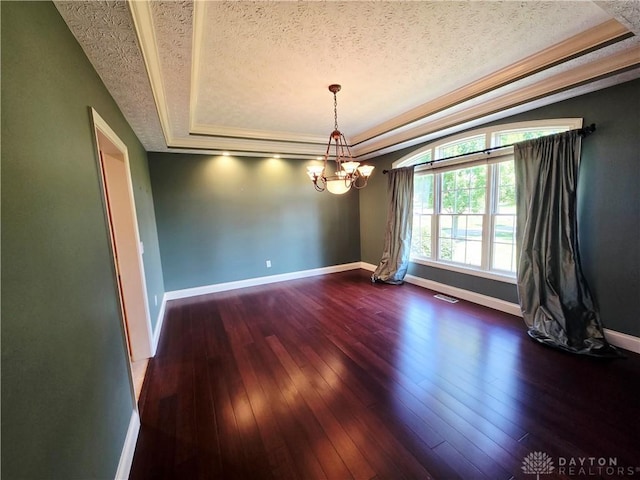 1962 Fountain View Dr, Dayton, OH 45414 - unfurnished room with a tray ceiling, a textured ceiling, a chandelier, and wood-type flooring