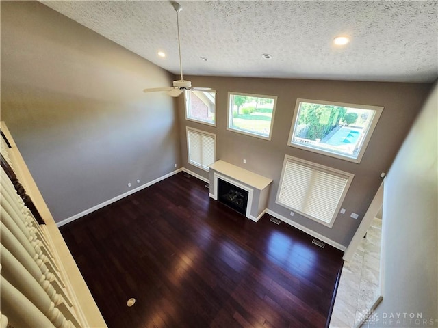 1962 Fountain View Dr, Dayton, OH 45414 - unfurnished living room with a textured ceiling, a fireplace, dark wood-style flooring, ceiling fan, and recessed lighting