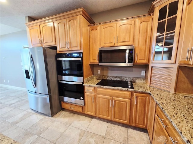 1962 Fountain View Dr, Dayton, OH 45414 - kitchen with appliances with stainless steel finishes, light stone counters, and glass insert cabinets