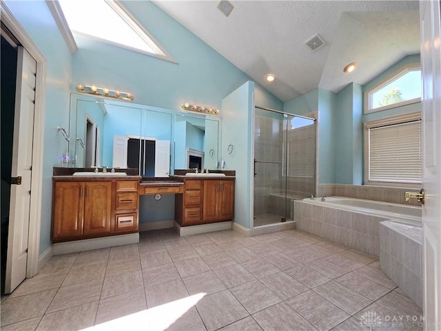 1962 Fountain View Dr, Dayton, OH 45414 - bathroom with lofted ceiling, double vanity, a bath, a shower stall, and tile patterned floors
