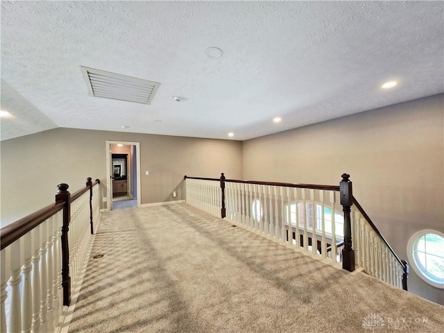 1962 Fountain View Dr, Dayton, OH 45414 - corridor with a textured ceiling, an upstairs landing, carpet flooring, recessed lighting, and vaulted ceiling