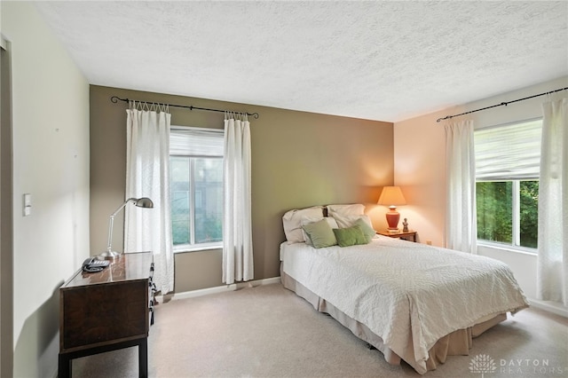 328 Shadywood Dr, Clayton, OH 45415 - bedroom with carpet floors and a textured ceiling