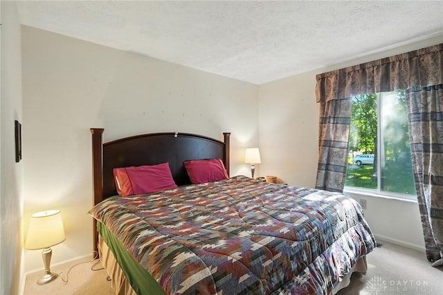 328 Shadywood Dr, Clayton, OH 45415 - carpeted bedroom with baseboards and a textured ceiling