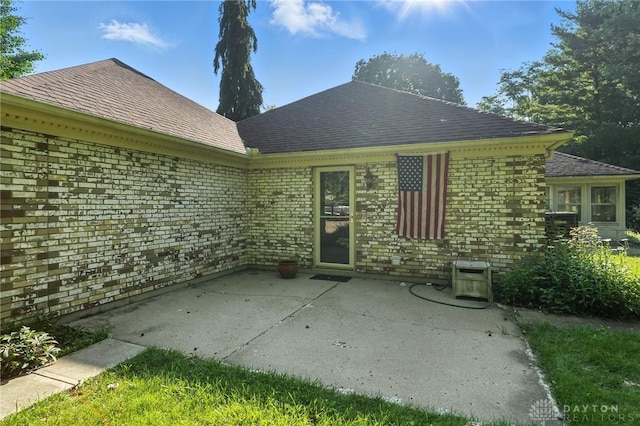 328 Shadywood Dr, Clayton, OH 45415 - rear view of property with a patio area, brick siding, and roof with shingles