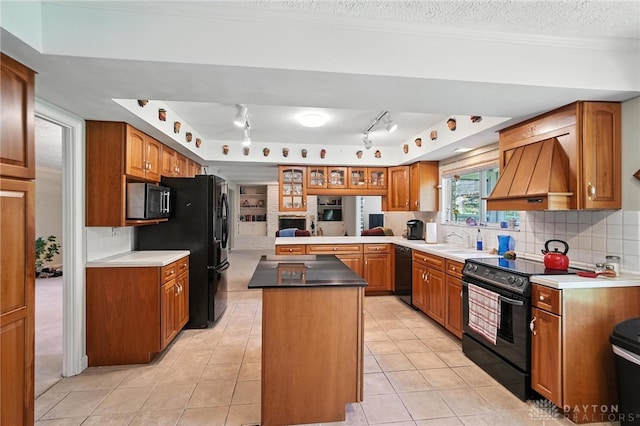 328 Shadywood Dr, Clayton, OH 45415 - kitchen with black appliances, custom range hood, light tile patterned floors, and tasteful backsplash