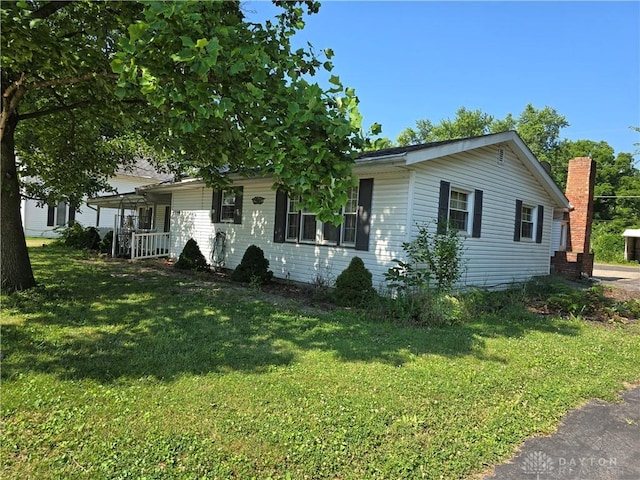 1119 N Maple St, Eaton, OH 45320 - ranch-style home featuring a front yard and covered porch