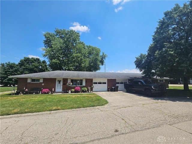 103 N Taylor St Unit 101, Farmersville, OH 45325 - single story home featuring a garage, concrete driveway, brick siding, and a front yard