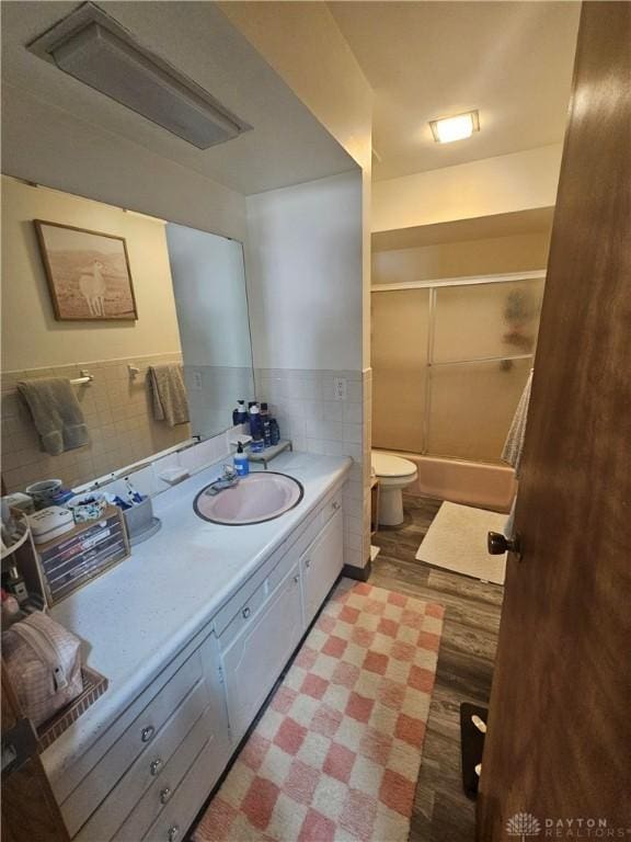 103 N Taylor St Unit 101, Farmersville, OH 45325 - bathroom featuring vanity, tile walls, and shower / bath combination with glass door