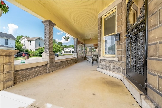 307 E Cherry St, New Paris, OH 45347 - covered porch featuring a residential view