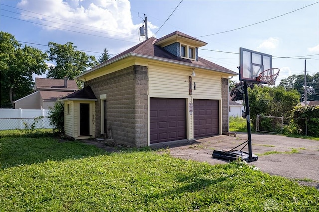 307 E Cherry St, New Paris, OH 45347 - view of home's exterior with a garage