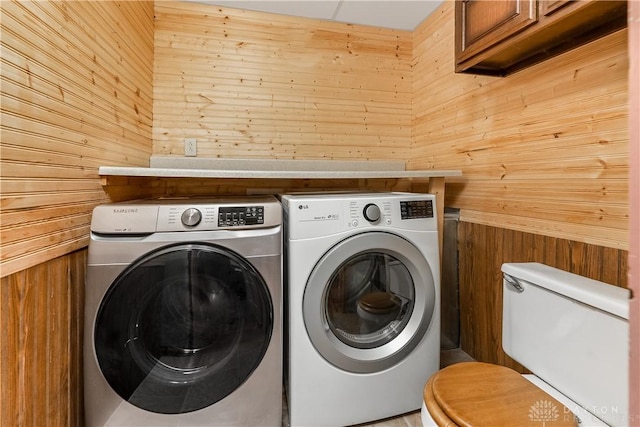 307 E Cherry St, New Paris, OH 45347 - washroom featuring washer and clothes dryer and wooden walls