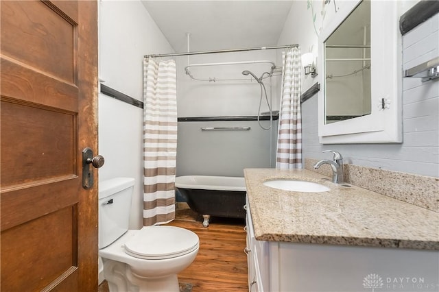 307 E Cherry St, New Paris, OH 45347 - full bath with wood finished floors, vanity, and shower / bath combination with curtain