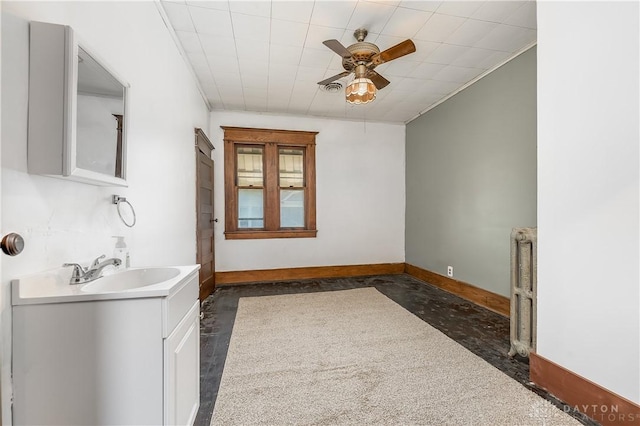 307 E Cherry St, New Paris, OH 45347 - bathroom featuring ceiling fan, vanity, and crown molding