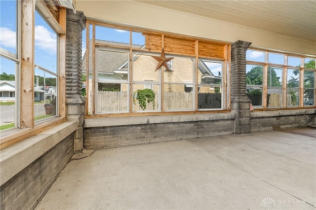 307 E Cherry St, New Paris, OH 45347 - unfurnished sunroom with concrete flooring and healthy amount of natural light
