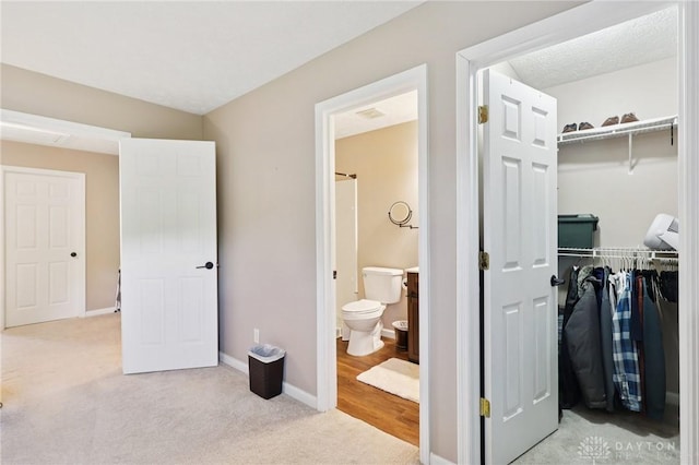 4307 Dobbin Cir, Dayton, OH 45424 - bedroom with a closet, light colored carpet, a walk in closet, and ensuite bath