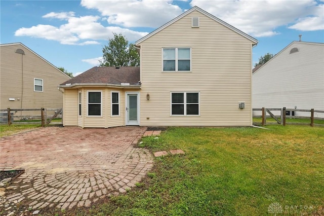 4307 Dobbin Cir, Dayton, OH 45424 - rear view of house with a fenced backyard and a patio area