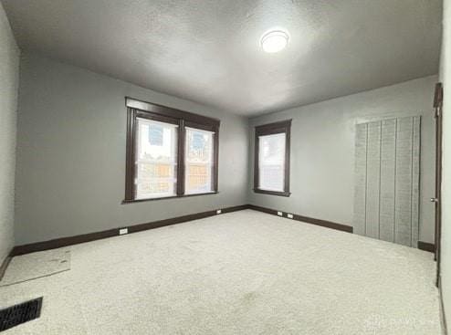 1239 Sliker Ave, Cincinnati, OH 45205 - unfurnished bedroom featuring carpet flooring and multiple windows
