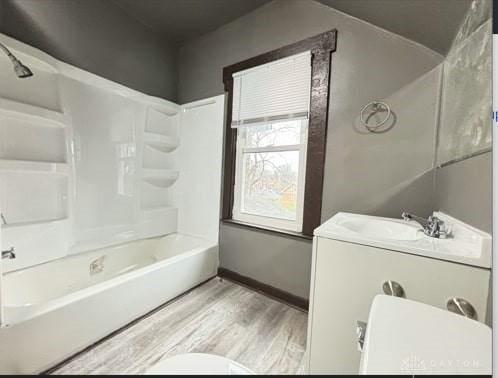 1239 Sliker Ave, Cincinnati, OH 45205 - bathroom with wood finished floors and washtub / shower combination