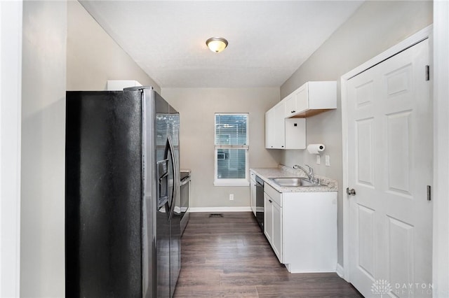 2215 Pearl St, Middletown, OH 45044 - kitchen with appliances with stainless steel finishes, light countertops, dark wood finished floors, and white cabinetry