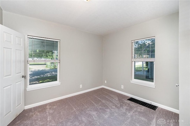 2215 Pearl St, Middletown, OH 45044 - empty room featuring carpet floors and plenty of natural light