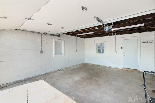 2215 Pearl St, Middletown, OH 45044 - garage with a garage door opener and concrete block wall