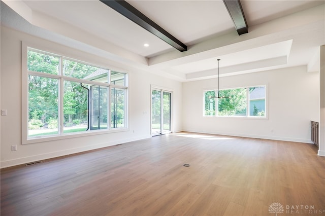 9508 Magnolia Ct, Washington Twp, OH 45458 - unfurnished living room with beamed ceiling, light wood-type flooring, a chandelier, and a raised ceiling