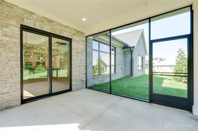 9508 Magnolia Ct, Washington Twp, OH 45458 - doorway featuring concrete flooring, brick wall, and recessed lighting