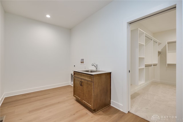 9508 Magnolia Ct, Washington Twp, OH 45458 - laundry area featuring hookup for a washing machine, light wood finished floors, recessed lighting, and electric dryer hookup