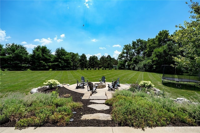 7949 Bending Willow Ct, Clearcreek Twp, OH 45068 - view of home's community with a fire pit, a trampoline, a patio, a lawn, and view of scattered trees
