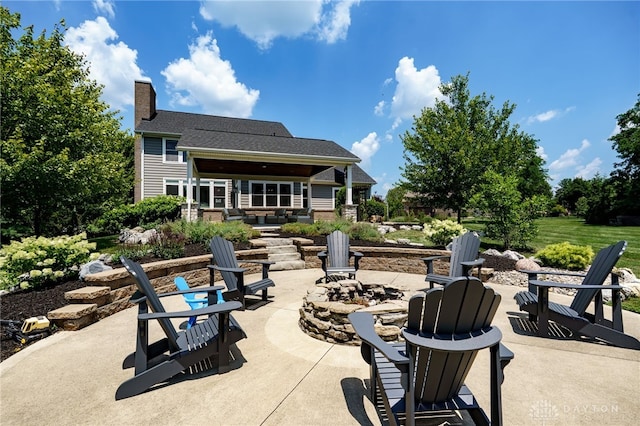 7949 Bending Willow Ct, Clearcreek Twp, OH 45068 - view of patio with a fire pit
