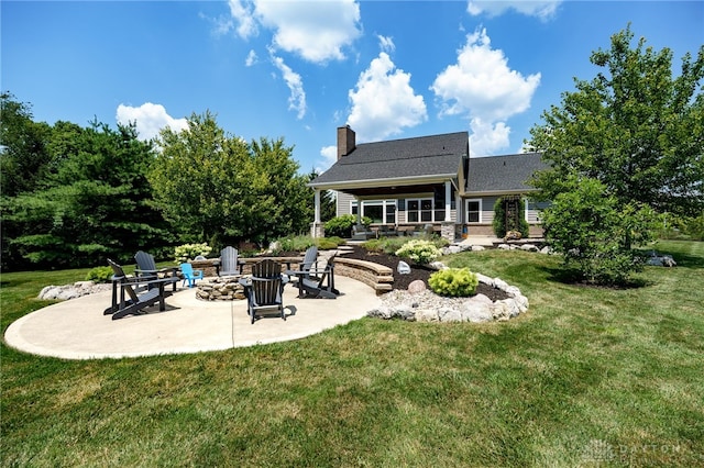 7949 Bending Willow Ct, Clearcreek Twp, OH 45068 - rear view of property with a fire pit, a patio area, a yard, and a chimney